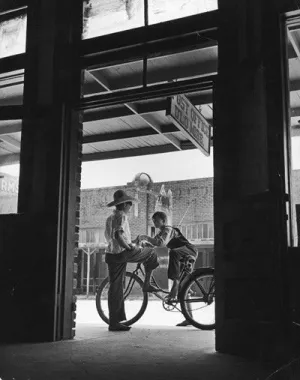 Post Office with two boys and bicycle